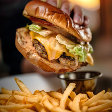 Restaurant style cheeseburger and fries